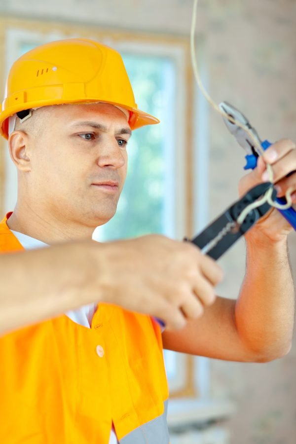electrician installing electricity in a new house